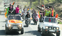 Workers at a rally on the arrival of Chief Minister PK Dhumal in Nurpur