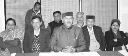 Health Minister Rajiv Bindal addresses a press conference at Solan
