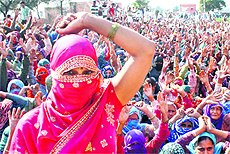 Women protesters shout pro-reservation slogans at Ramayan village in Hisar 