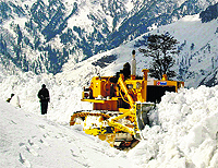 Snow-clearing operation in full swing near Gulaba, about 23 km from Manali on the Manali-Leh highway.