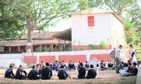 Students study in the open at Government High School in Sabbar village of Kathua district