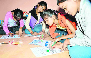 Kids participate in a creative art event at Euro Kids International School, Shivalik Nagar, in Haridwar on Sunday. 