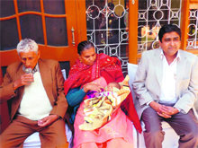 Bhim Singh and Krishna with their newborn son and Dr Anurag Bishnoi appeal for stricter traffic laws in Hisar. 