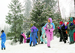 Tourists enjoy a fresh spell of snowfall near the Solang valley on Sunday