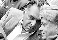 CM PK Dhumal and Congress MLA GS Bali discuss a point at the inauguration function of Government College, Nagrota Bagwan, on Sunday