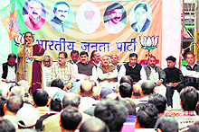 A BJP leader addresses a gathering during a public meeting at Rehari Chowk in Jammu on Sunday. 