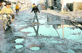Water accumulates on the broken Leather Complex road in Basti Peer Daad in Jalandhar.