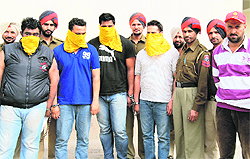 The accused, who allegedly abducted an NRI last year, in the custody of the Ludhiana Police on Sunday