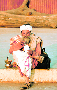 A seer enjoys popcorns at the Ludhiana railway station