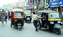 Three-wheelers have increased in number in the city.