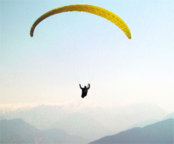 Swiss paraglider Thomas paragliding in Beguldhar area of Munsiyari in Pithoragarh district. 