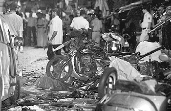 Wreckage of motorbikes at the site of the bomb explosion outside the Opera House in Mumbai.