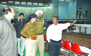 Returning Officer Iqbal Singh Sandhu checks arrangements at the counting centre for the Jalandhar (Central) constituency in Jalandhar on Monday.