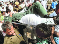 The injured pilot of the Mirage aircraft being taken to hospital.