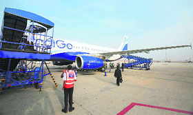 Passengers board an IndiGo Airlines A320 aircraft at Bangalore airport. The low fare carrier, launched in 2006, has climbed to second place in market share at the expense of Air India and Kingfisher and is the only one of India's six main carriers making a profit, for now at least. 