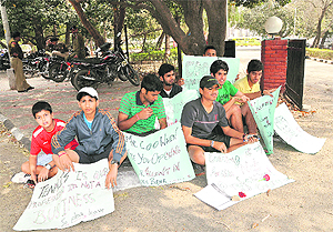 CLTA trainees protest at Sector 10 in Chandigarh on Tuesday.