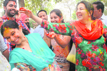Members of Congress candidate Balbir Singh Sidhus family celebrate his victory with colours in Mohali on Tuesday. 