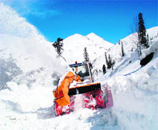 A snow cutter clears a road near Gulaba on the Manali-Leh highway.