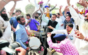 SAD supporters celebrate the victory of the party in Ludhiana on Tuesday.