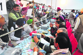 Employees busy counting votes at SCD Government College.