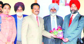 Dr Bikramjit Singh Virk being welcomed by faculty members of the GTB Institute of Management of Technology at Dakha. 