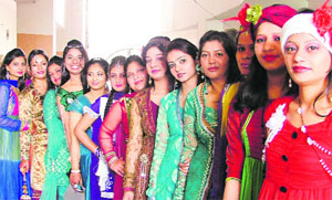 Girls of Diploma Fashion Designing department pose for photograph during the farewell party at the MTSM College for Women in Ludhiana