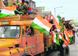 Congress supporters celebrate their partys win in Imphal on Tuesday.