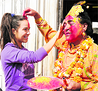 Devotees play tilak Holi at the Durgiana Temple shrine in Amritsar on Wednesday