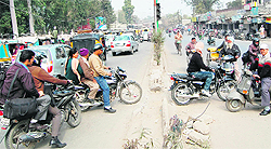 A divider damaged by commuters to make way to the other side of the road in Amritsar