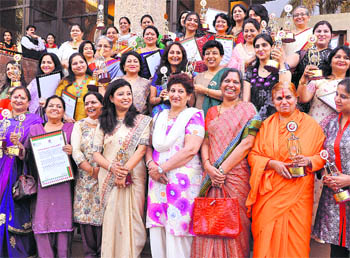 Women in a happy mood after receiving awards given by Gurukul Vidyapeeth and S4 Trust to tnem at a function held at the CII in Sector 31, Chandigarh, on Wednesday. 