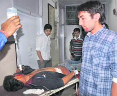 Ashish (on stretcher) and Sudhir, injured during a clash, at the Government Multi-Speciality Hospital at Sector 16 in Chandigarh on Wednesday. 