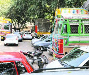 Impounded trucks by UT Excise and Taxation department occupy space in public parking at Sector 17, Chandigarh on Wednesday.