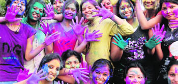 Girls in a festive mood on the occasion of Holi in Dehradun on Wednesday. 