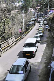 Activists of the Shimla Commercial Vehicles Union hold a vehicle rally against the hike in the token tax in Shimla on Wednesday.