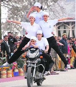 Policewomen display their skills on a motorcycle at the Ridge in Shimla on Wednesday.
