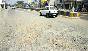The badly damaged stretch of Nakodar Road near Wadala Chowk in Jalandhar. 