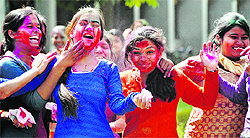 Students of Government Polytechnic play Holi on the college campus in Ludhiana on Wednesday
