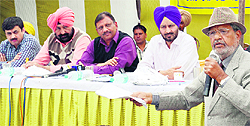 PS Bhatti of an NGO conveys his point to MC officials during a public hearing in Amritsar on Friday
