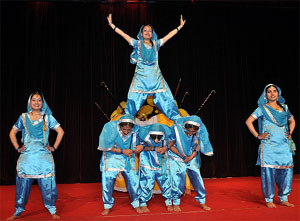 Students of MBBS courses present a formation while performing bhangra and (Top)stride down the ramp during a fashion show at Arrhythmia, the annual fest of the Adesh Institute of Medical Sciences and Research (AIMSR), held in Bathinda on Friday