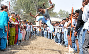 An ITI student takes part in the high jump contest during the zonal sports competition held in Bathinda on Friday.