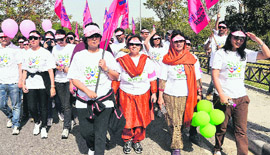 Participants take part in a cancer awareness walk at the Sukhna Lake in Chandigarh on Friday