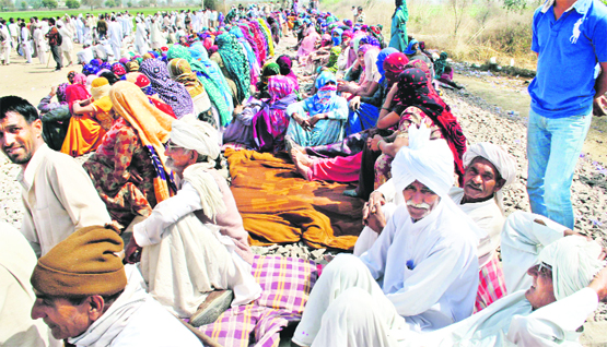 Jat protesters squat on railway tracks at Mayyar village, Hisar