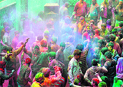 People celebrate Holi in Shimla on Thursday