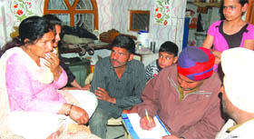 The police records the statement of Surjit Kaur from whom armed miscreants snatched a gold chain at gunpoint in Jalandhar on Friday.  