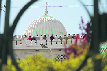 Devotees offer Friday prayers at a mosque in the Panjtirthi area of Jammu.