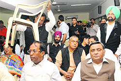 A newly elected MLA brings his own chair at the BJP meeting in Chandigarh on Friday