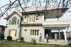 Journalists stand outside a suspected former residence of Osama bin Laden in Haripur, 50 km from Islamabad, which is near Abbottabad.