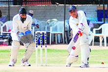Players in action during a match of the FCIS International Cricket League tourney in Chandigarh