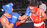 K Roshan Singh (left) lands a punch on Manik of Punjab during a match of AK Mishra All-India Senior Men Boxing meet in Chandigarh on Saturday