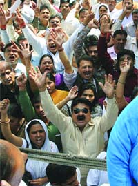 BJP workers protest against the Congress over the issue of MLA Marwah's daughter's admission, at Jantar Mantar in New Delhi on Saturday